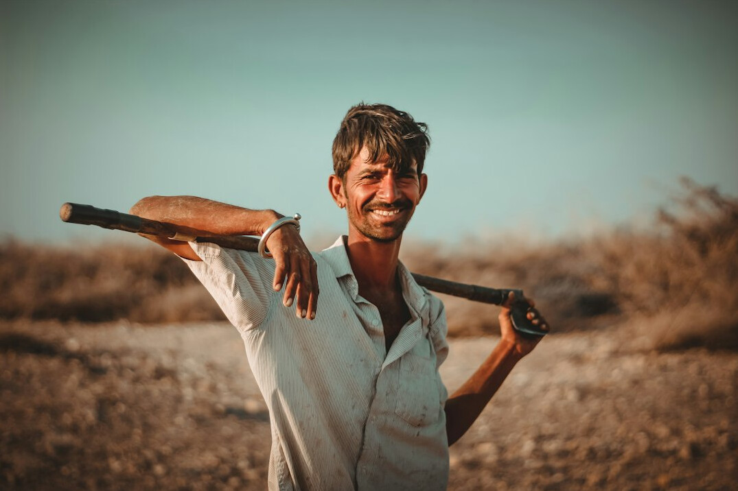 Man in light shirt smiling portrait